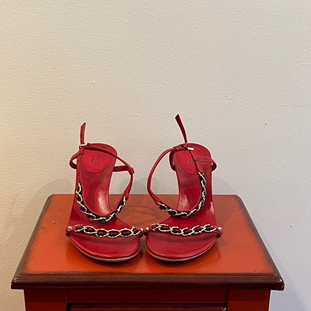 Gucci red heels with navy accents.